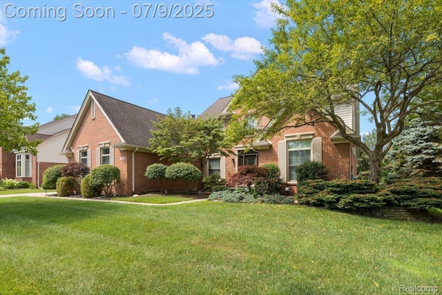 6591 Tree Knoll Dr, Troy, MI 48098 - view of front of property featuring brick siding and a front yard