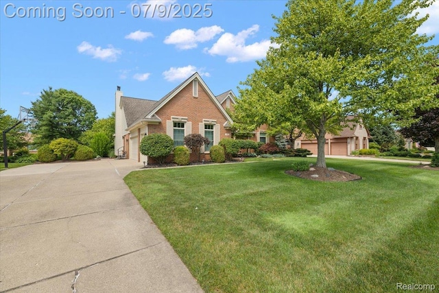 6591 Tree Knoll Dr, Troy, MI 48098 - view of front of house featuring brick siding, a front yard, concrete driveway, a garage, and a chimney