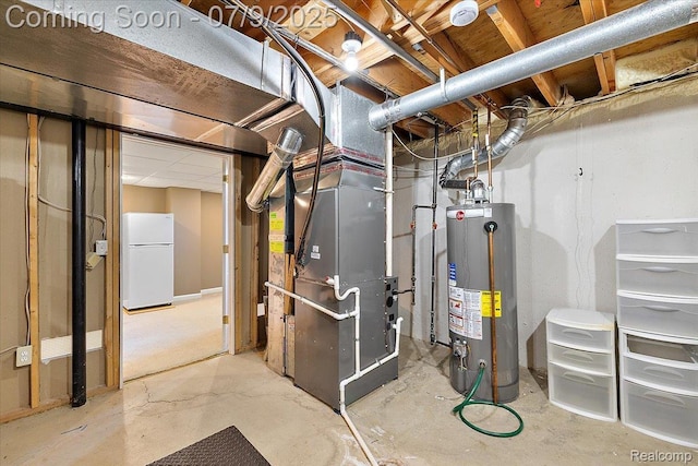 6591 Tree Knoll Dr, Troy, MI 48098 - unfinished below grade area with gas water heater, freestanding refrigerator, and heating unit
