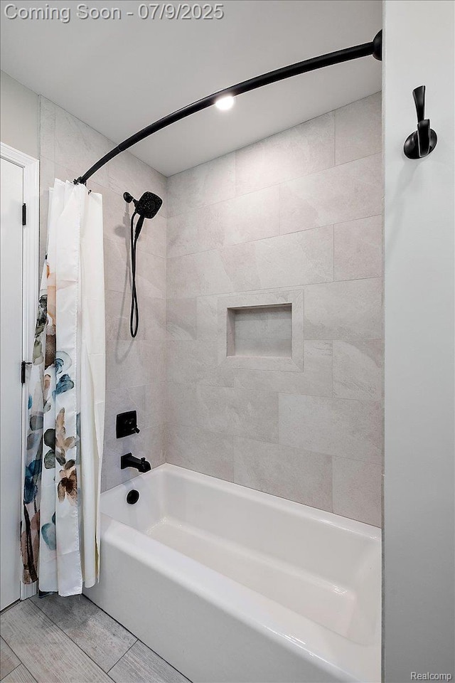 6591 Tree Knoll Dr, Troy, MI 48098 - bathroom featuring shower / tub combo and wood finished floors