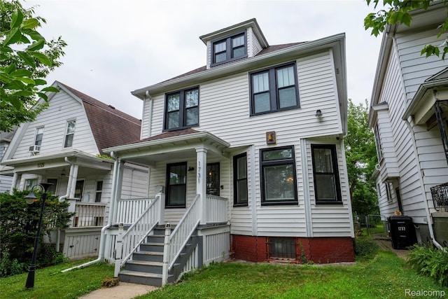 1731 Parker St, Detroit, MI 48214 - american foursquare style home featuring a porch and a front yard