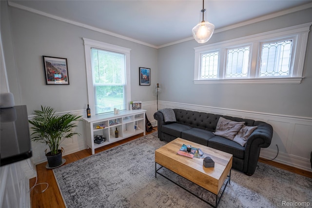 1731 Parker St, Detroit, MI 48214 - living area with plenty of natural light, wood finished floors, a wainscoted wall, and ornamental molding