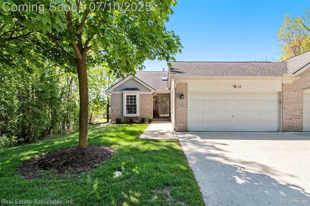 41503 Haggerty Woods Ct Unit 35, Canton, MI 48187 - view of front facade with brick siding, an attached garage, driveway, a front lawn, and a shingled roof