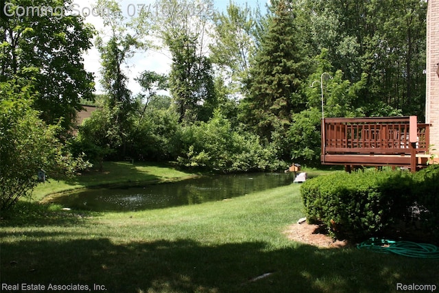 41503 Haggerty Woods Ct Unit 35, Canton, MI 48187 - view of green lawn featuring a deck with water view