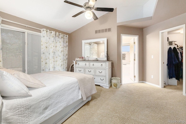 5103 Coachlight Dr, Fenton, MI 48430 - bedroom featuring light colored carpet, a spacious closet, vaulted ceiling, a ceiling fan, and ensuite bath