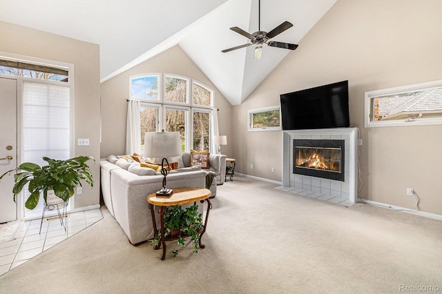 5103 Coachlight Dr, Fenton, MI 48430 - living area featuring plenty of natural light, a tile fireplace, ceiling fan, high vaulted ceiling, and carpet flooring
