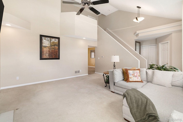 5103 Coachlight Dr, Fenton, MI 48430 - living area with light carpet, high vaulted ceiling, ceiling fan, and stairway