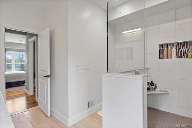 900 Mcdonald Dr, Northville, MI 48167 - bathroom featuring a walk in shower and wood finished floors