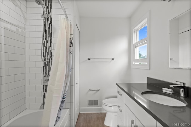 900 Mcdonald Dr, Northville, MI 48167 - full bathroom with vanity, shower / bath combo, and wood finished floors