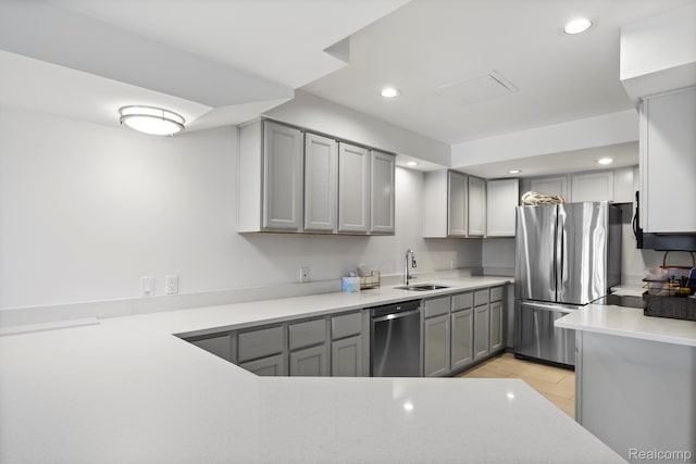 900 Mcdonald Dr, Northville, MI 48167 - kitchen with stainless steel appliances, gray cabinets, recessed lighting, and light countertops