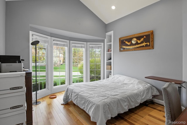 900 Mcdonald Dr, Northville, MI 48167 - bedroom with multiple windows, wood finished floors, high vaulted ceiling, and recessed lighting