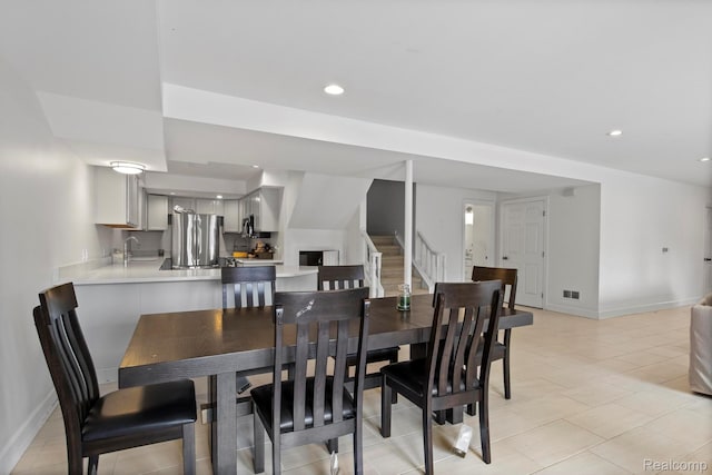 900 Mcdonald Dr, Northville, MI 48167 - dining area with stairs, light tile patterned floors, and recessed lighting