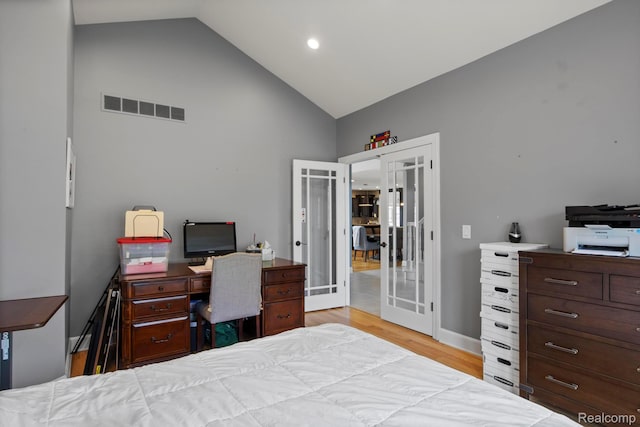 900 Mcdonald Dr, Northville, MI 48167 - bedroom featuring french doors, high vaulted ceiling, light wood-style flooring, and a desk