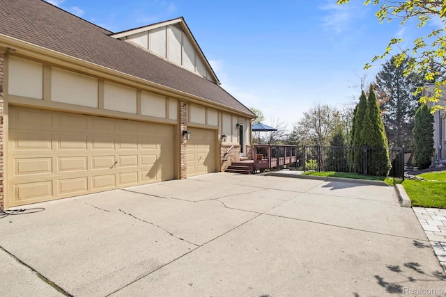 900 Mcdonald Dr, Northville, MI 48167 - view of side of home with concrete driveway, a shingled roof, brick siding, a garage, and board and batten siding