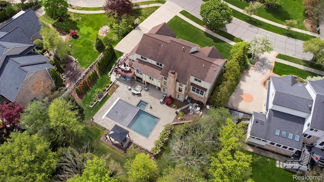 900 Mcdonald Dr, Northville, MI 48167 - aerial perspective of suburban area featuring a pool area