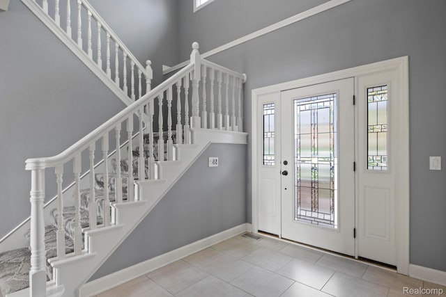 900 Mcdonald Dr, Northville, MI 48167 - tiled entryway featuring plenty of natural light, stairs, and a high ceiling
