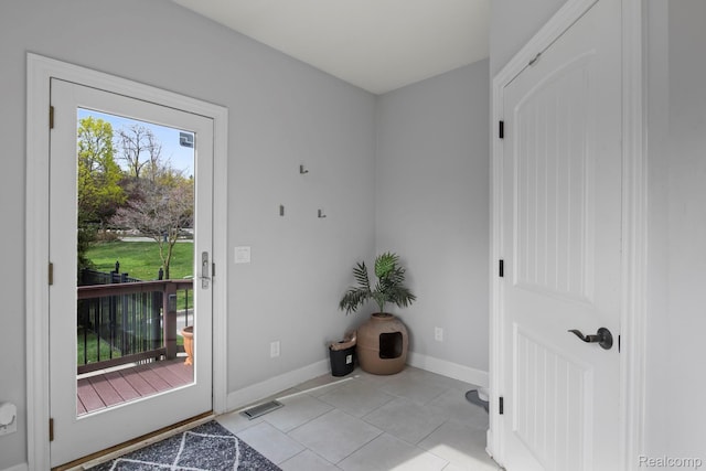 900 Mcdonald Dr, Northville, MI 48167 - doorway to outside with light tile patterned floors and baseboards