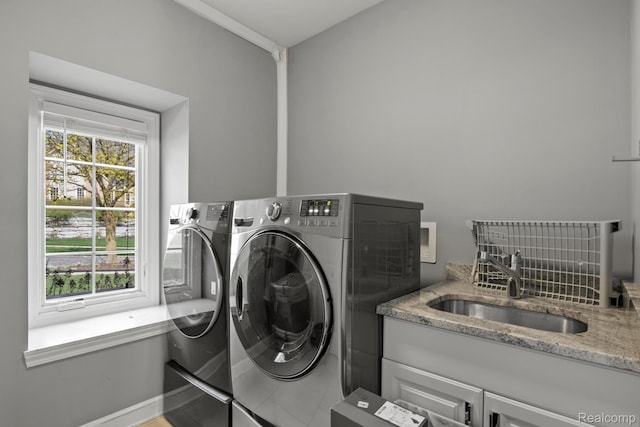 900 Mcdonald Dr, Northville, MI 48167 - laundry room featuring washer and dryer and cabinet space