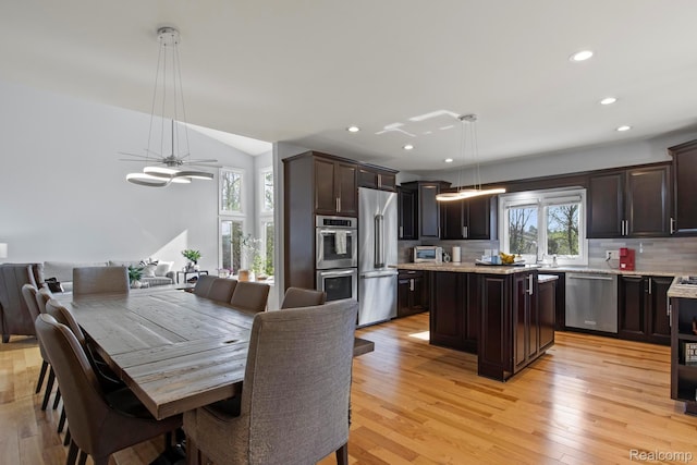 900 Mcdonald Dr, Northville, MI 48167 - dining space with recessed lighting, light wood-style floors, and lofted ceiling