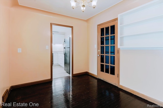 16219 Normandy St, Detroit, MI 48221 - empty room with a chandelier and hardwood / wood-style floors