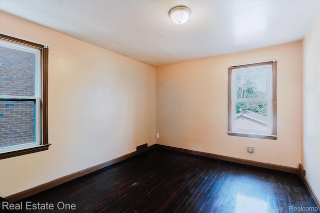 16219 Normandy St, Detroit, MI 48221 - empty room featuring dark wood-style flooring and baseboards