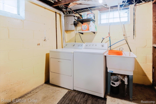 16219 Normandy St, Detroit, MI 48221 - laundry area featuring washer and clothes dryer, electric panel, and concrete block wall