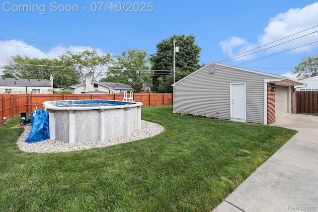 39408 Atkinson Dr, Sterling Heights, MI 48313 - fenced backyard featuring an outdoor structure, concrete driveway, and a detached garage