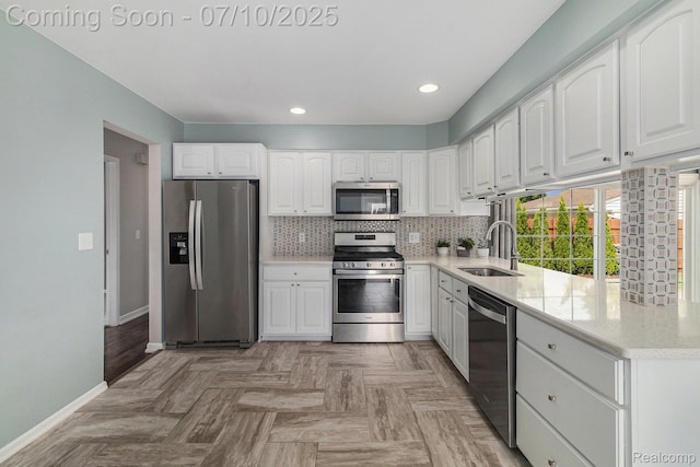 39408 Atkinson Dr, Sterling Heights, MI 48313 - kitchen with stainless steel appliances, white cabinetry, decorative backsplash, recessed lighting, and light stone countertops