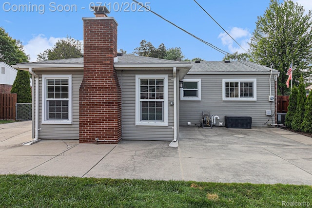 39408 Atkinson Dr, Sterling Heights, MI 48313 - back of property with a patio area and a chimney