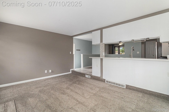 39408 Atkinson Dr, Sterling Heights, MI 48313 - unfurnished living room with carpet flooring and baseboards