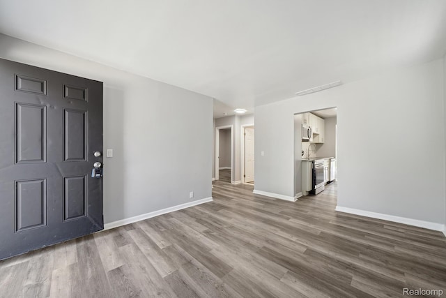 2245 Spring Hill Ave, Inkster, MI 48141 - entryway featuring wood finished floors and baseboards