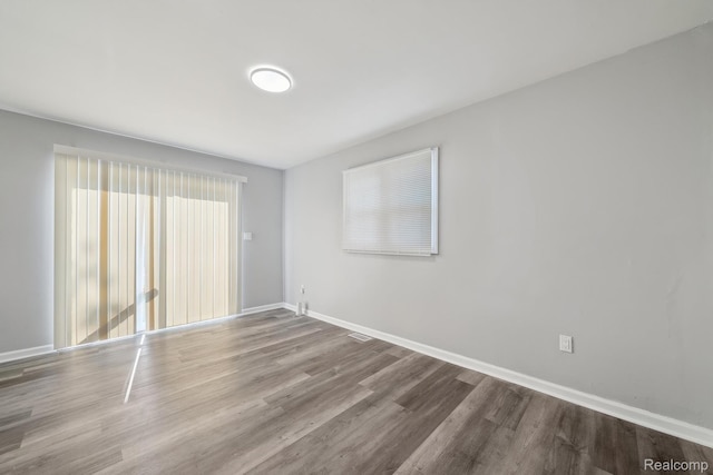 2245 Spring Hill Ave, Inkster, MI 48141 - spare room featuring wood finished floors and baseboards