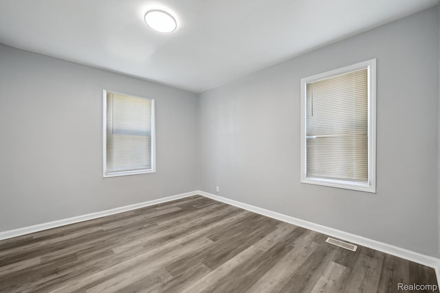2245 Spring Hill Ave, Inkster, MI 48141 - spare room featuring wood finished floors and baseboards