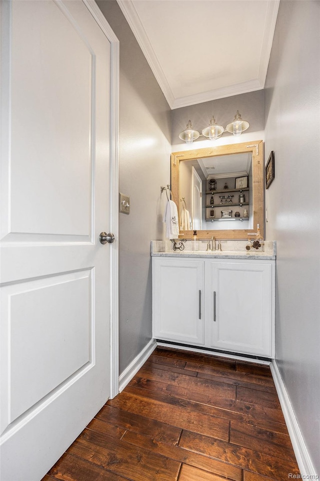 9780 Oak Valley Dr, Clarkston, MI 48348 - bathroom featuring crown molding, vanity, and hardwood / wood-style floors
