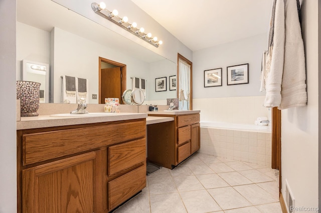 9780 Oak Valley Dr, Clarkston, MI 48348 - bathroom with double vanity, tile patterned floors, and a bath
