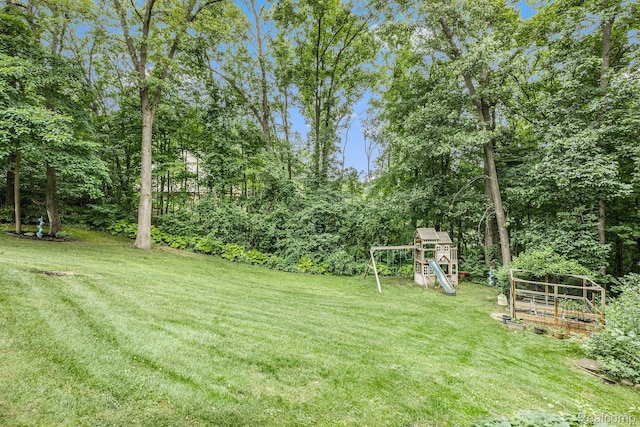 9780 Oak Valley Dr, Clarkston, MI 48348 - view of grassy yard featuring a playground