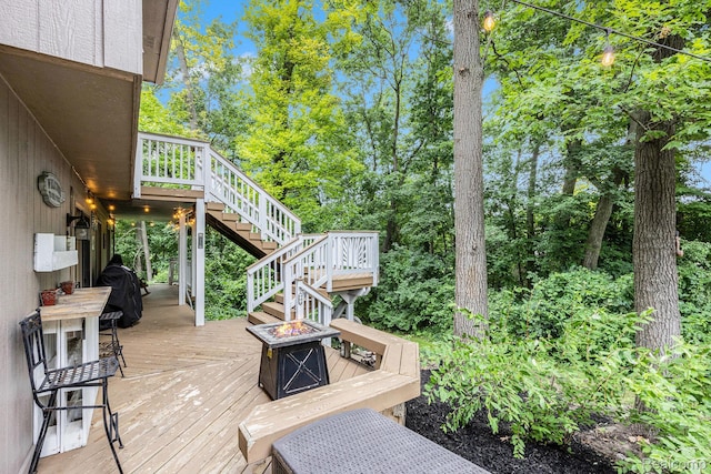 9780 Oak Valley Dr, Clarkston, MI 48348 - wooden deck featuring stairway and a fire pit
