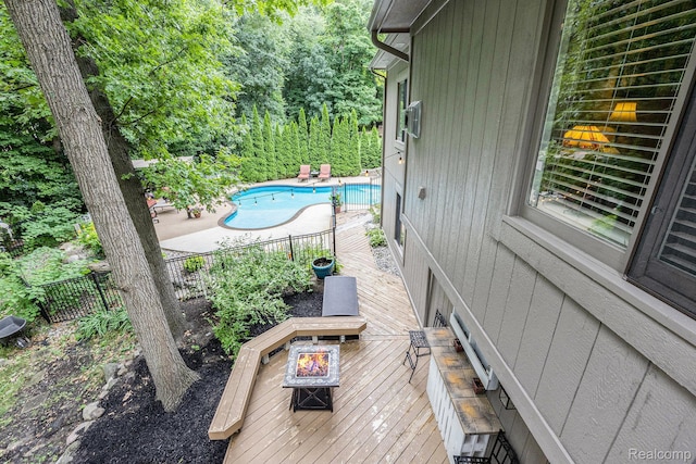 9780 Oak Valley Dr, Clarkston, MI 48348 - view of pool with an outdoor fire pit and a wooden deck