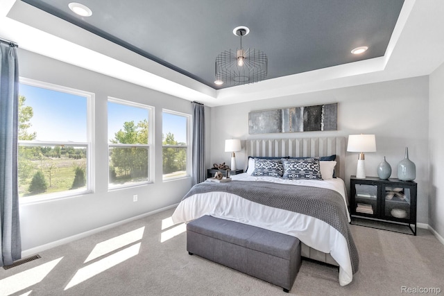 2768 Silo Dr, Saline, MI 48176 - carpeted bedroom with a tray ceiling, multiple windows, and recessed lighting