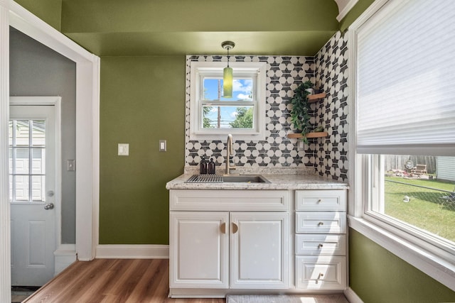 352 W Tacoma St, Clawson, MI 48017 - bathroom with plenty of natural light, vanity, and wood finished floors