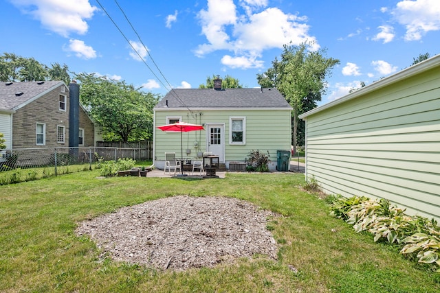 352 W Tacoma St, Clawson, MI 48017 - back of house featuring a chimney and a patio area