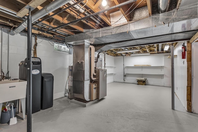 3416 Northlands Ave, Jackson, MI 49201 - below grade area featuring a water softener and heating unit