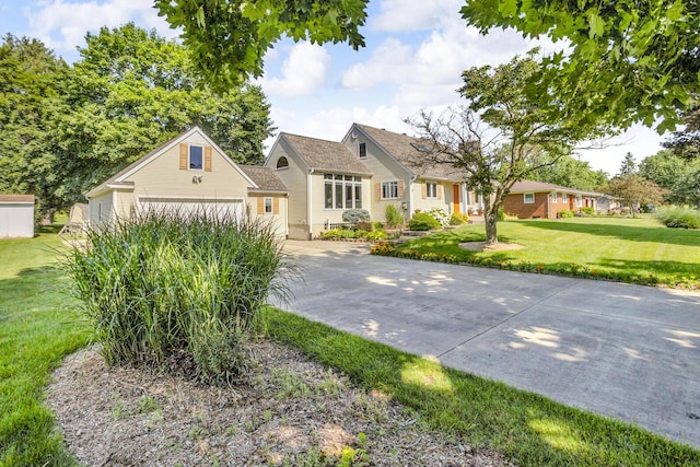 3416 Northlands Ave, Jackson, MI 49201 - view of front of home featuring concrete driveway, a front lawn, and brick siding