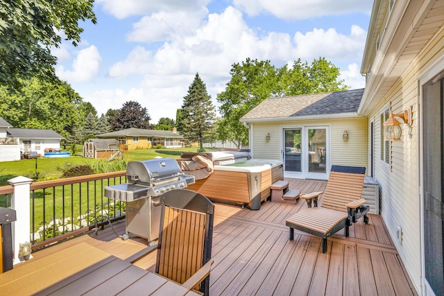 3416 Northlands Ave, Jackson, MI 49201 - wooden terrace with a hot tub, area for grilling, and a yard