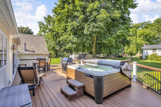 3416 Northlands Ave, Jackson, MI 49201 - deck with a hot tub, a lawn, and area for grilling