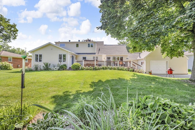 3416 Northlands Ave, Jackson, MI 49201 - view of front of home featuring an attached garage, a wooden deck, and a front yard