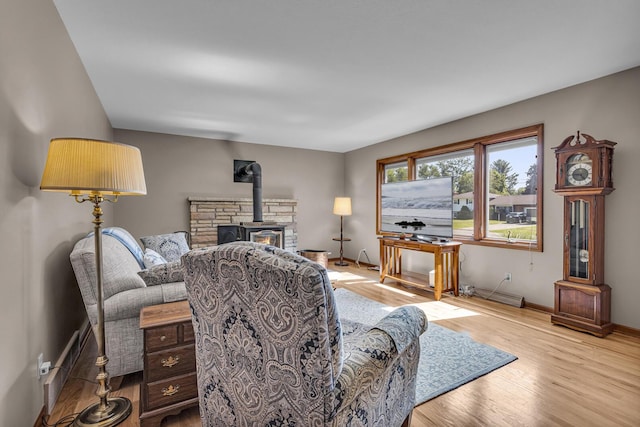 3416 Northlands Ave, Jackson, MI 49201 - living room featuring a wood stove and wood finished floors
