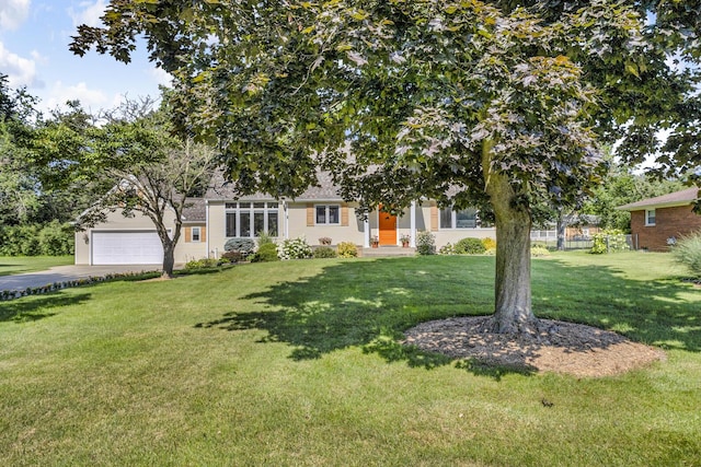 3416 Northlands Ave, Jackson, MI 49201 - obstructed view of property featuring driveway and an attached garage
