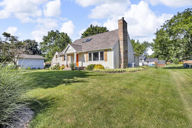 3416 Northlands Ave, Jackson, MI 49201 - view of front of home with a chimney, a front lawn, and roof with shingles