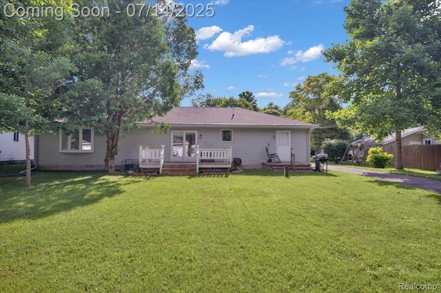 3117 Maumee Trl, Clyde, MI 48049 - rear view of property with a wooden deck